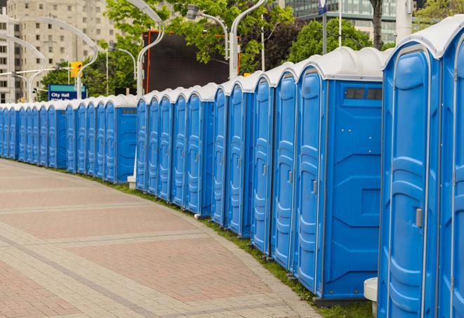 a row of portable restrooms set up for a special event, providing guests with a comfortable and sanitary option in Burlington, WI